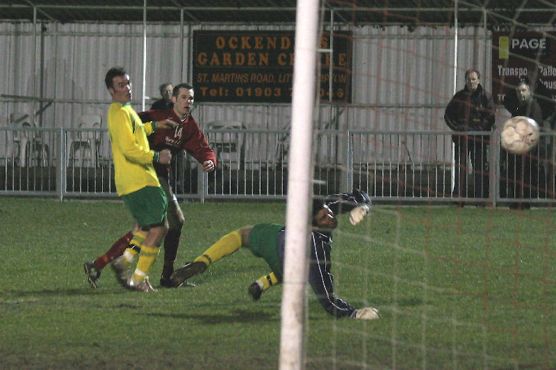 Andy Boxall beats Tyrone Hoare for Arundel's third goal
