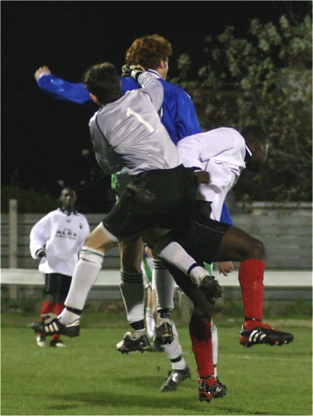 Gary Smart punches away from Sean Davies
