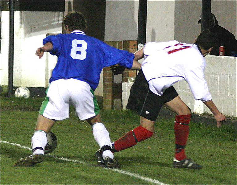 Neil Murfin beats Michael Frangou to keep the ball in 
