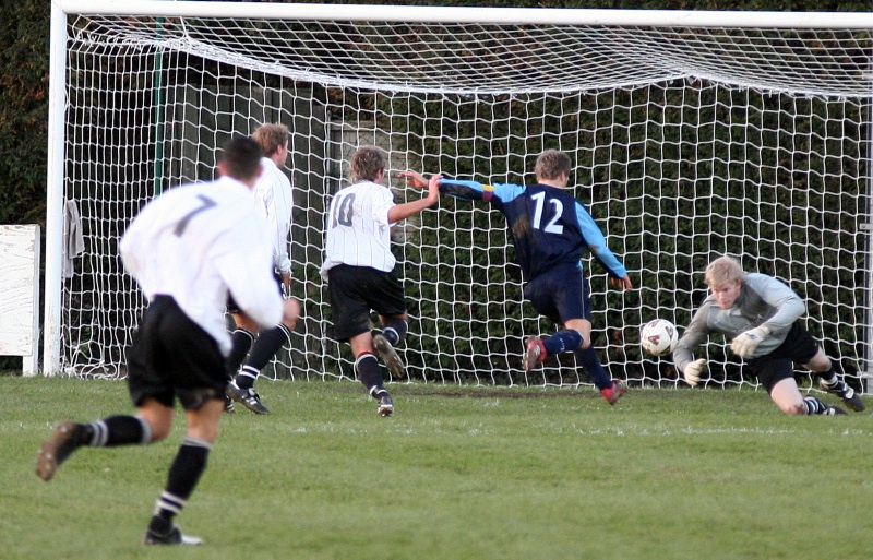 Tom Rand makes this save from Matt Beeston
