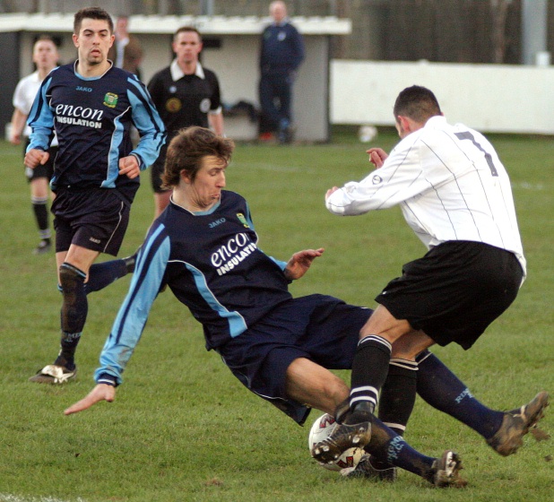 Phil Churchill is fouled by Glen Matten
