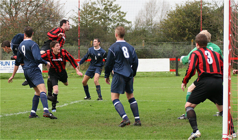 Pete Christodoulou and Adam Burton combine to deny Jason Wimbleton with Dave Walker (9), Jim Smith (6) and Lee Farrell (8) ready to pick up the pieces, Lee Howard (3) is on the post
