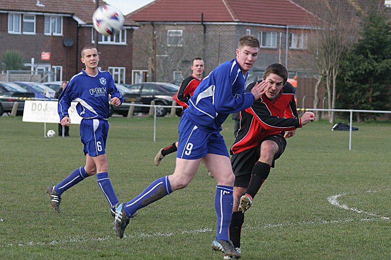 Wayne Mewett clears from Andy Smart
