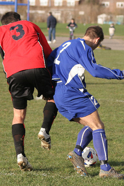 Sean Duffy (2) goes past Wayne Mewett (3)
