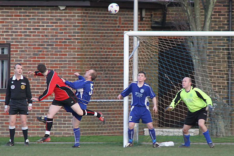 Rustington defence clear this attempt on goal by Liam Bull
