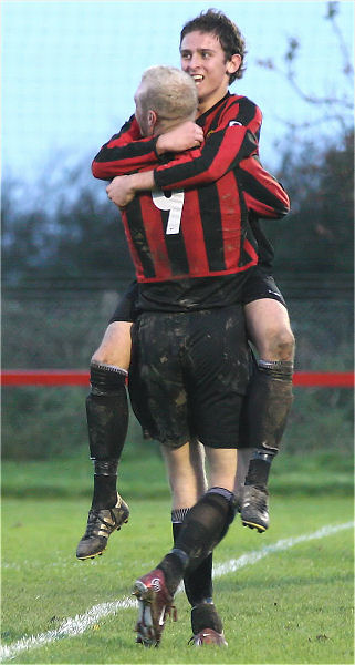Marc Cooper celebrates his goal, Wick's 4th, with Kane Evans scorer of the 3rd
