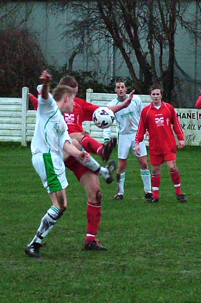 Alex Ward and Geoff Clark tussle for the ball
