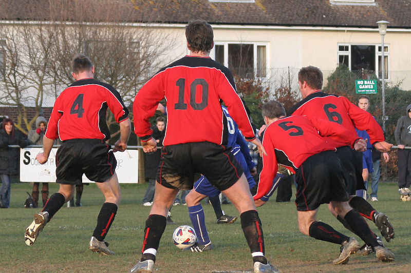 Benn Challen (6) on the ball is surrounded by Wayne Mewett (4), Phil White (10), Lionel Woodroofe (10) and Simon Bowyer (6)
