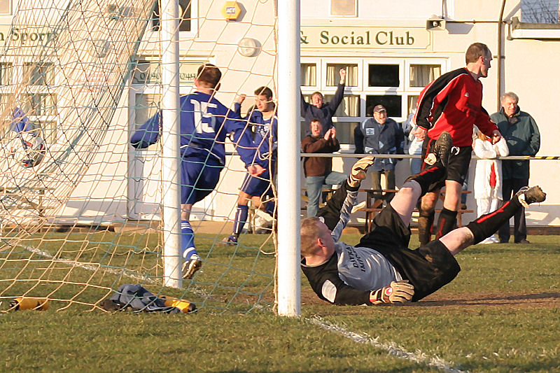 The ball is in the net and scorer Mike Hatch celebrates
