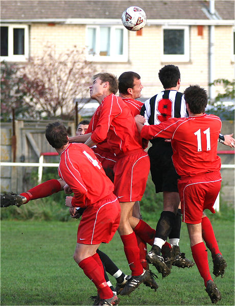 Phil Gault (9) is surrounded by Steyning players in this attack
