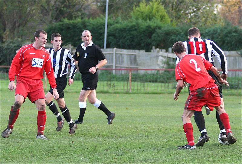 Mark Enticknap (10) shields the ball from James Edmonds (2)
