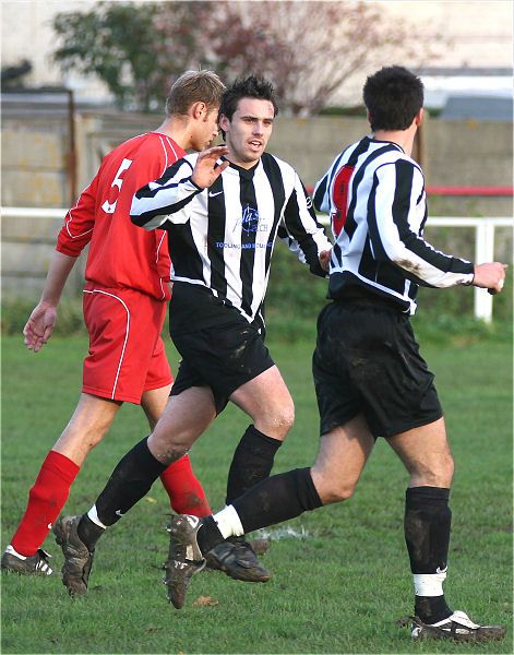 ...and is congratulated by Chris Maynard 
