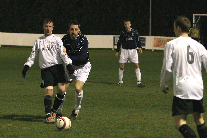 Lee Farrell knocks the ball back to Mike Huckett
