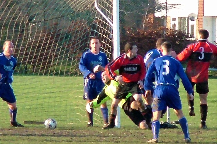 Rustington clear a goalmouth scramble
