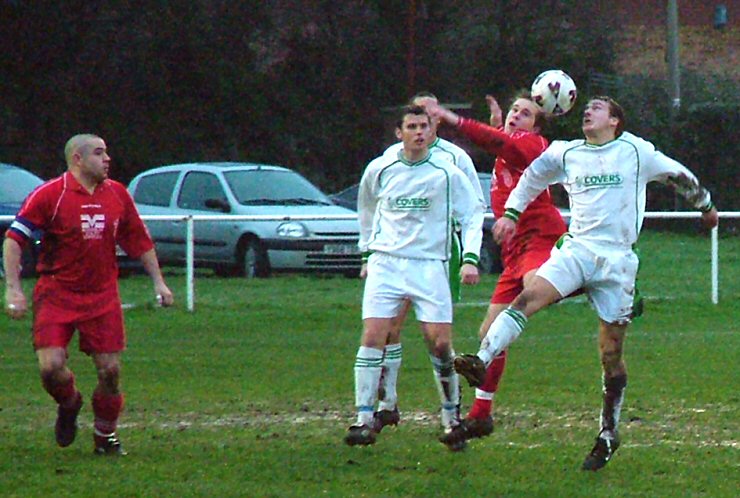 Luke Jones and David Wright watch as Ian Wallace(?) and Pete Robertson both go for the header
