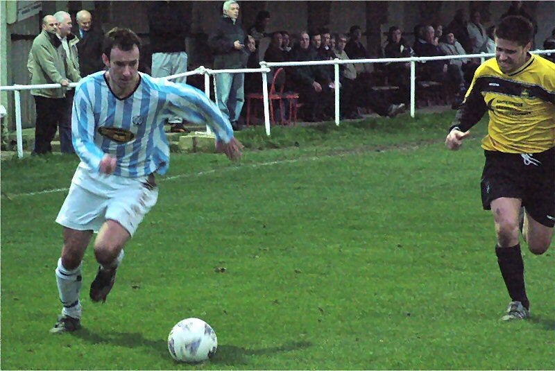 Worthing United's Dave Schneider gets down the right
