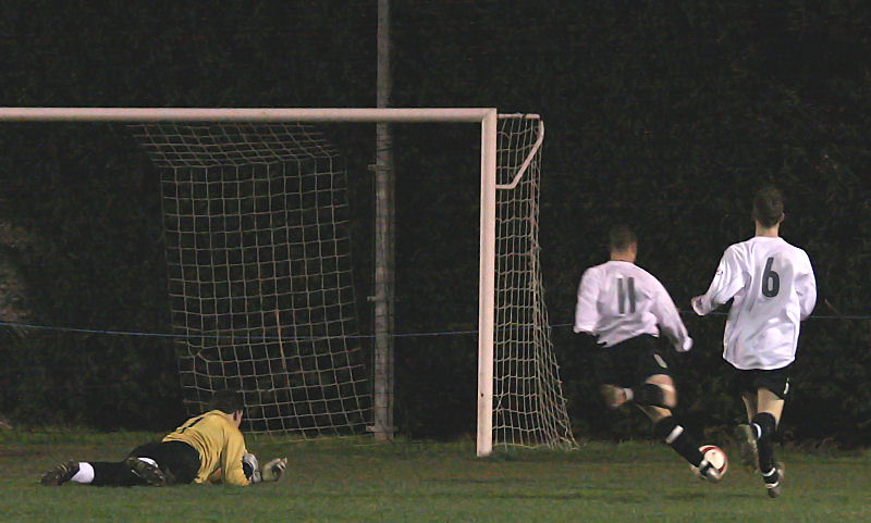 Lee Farrell goes round keeper Ian Chatfield and opens the scoring for EP from a tight angle
