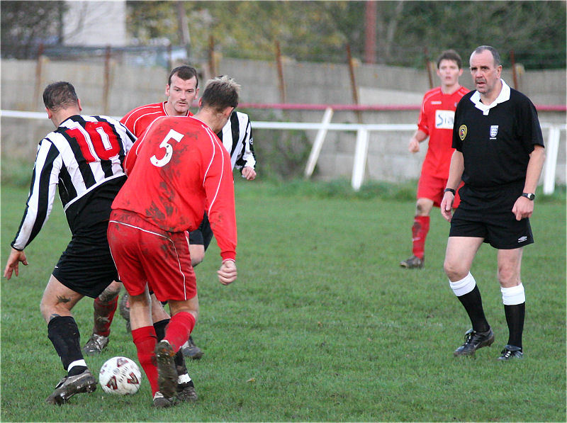 The referee looks on as Mark Enticknap (10) is tackled by Steve Duffett (5)
