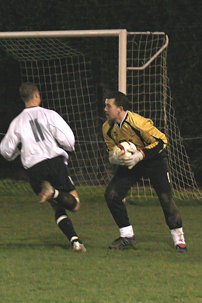 Ian Chatfield grabs the ball before Lee Farrell can get there
