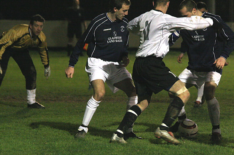 Lee Farrell takes on two defenders late in the game
