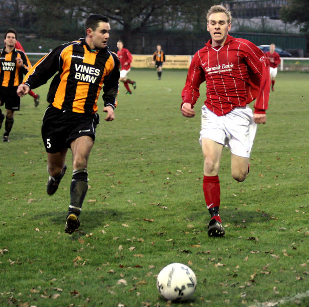 Danny Attwater (5) and Lee Barnard chase the ball
