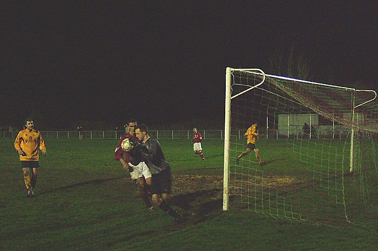 Gary Elliott gathers the ball, again under pressure from Jason Wimbleton
