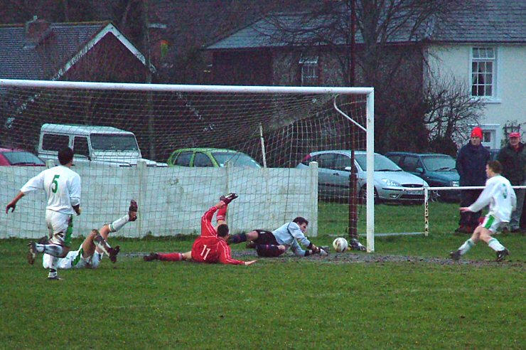 Barry Squires saves as John Ducker (11) goes close

