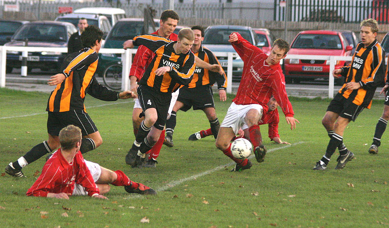 Mike Huckett tries a shot Steve Causon (4) tries to cut it out
