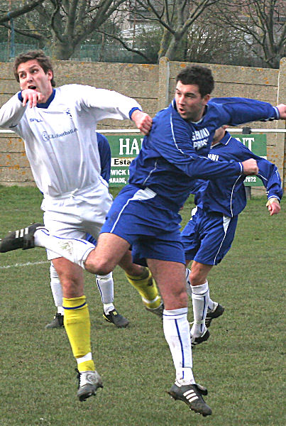 Richard Carter wins his header from Jamie Fiveash
