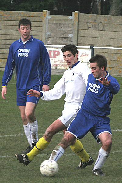Ben Milford wins this tackle as Martin O'Donnell looks on
