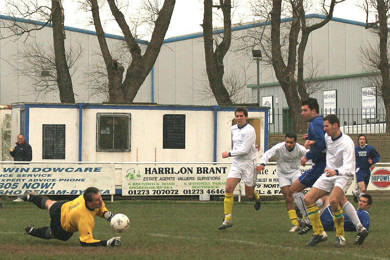Darren Lambert gets down to this attempt by Ben Milford, also on the deck
