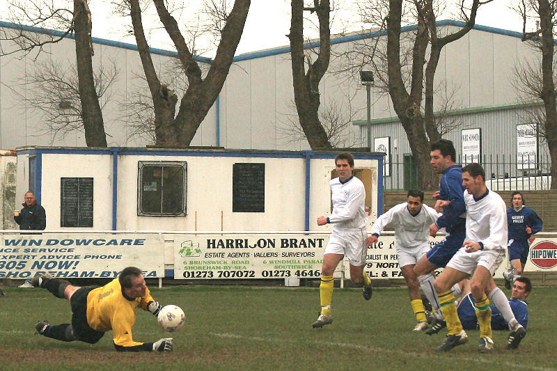 Darren Lambert gets down to this attempt by Ben Milford, also on the deck
