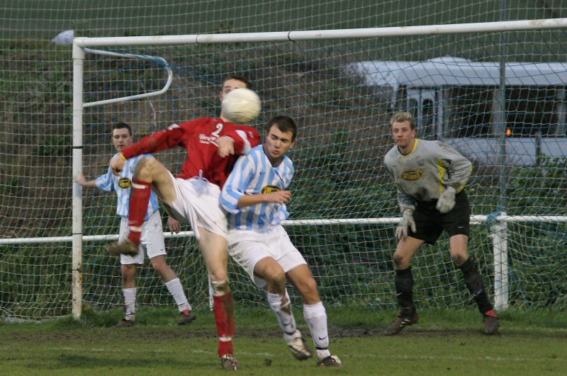 Arundel's Paul Jones (2) is challenged by Danny Keech with keeper Dean Fuller watching closely and Mark Aylett on the post

