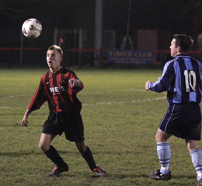 Ricky Robertshaw brings the ball down watched byKeith Miles
