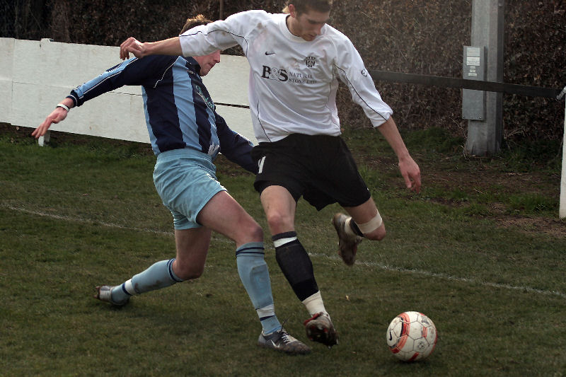 Dan McLoughlin is tackled by James Horner (?)
