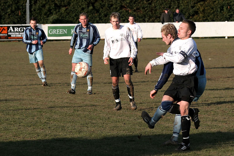 Matt Huckett is beaten to the ball by Paul Davies
