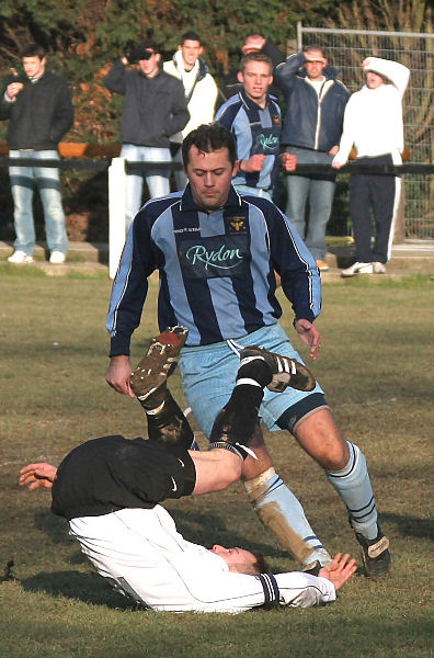 Matt Huckett takes a tumble in front of Steve Moore
