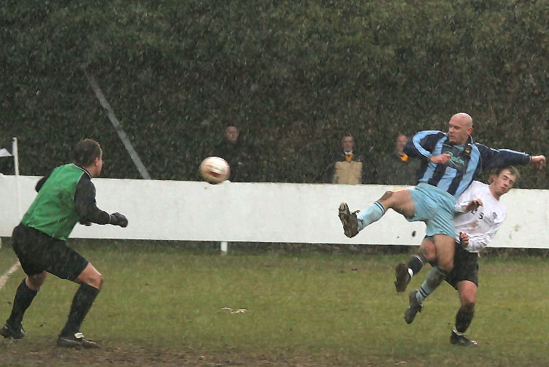 Grant Hearn cuts across Josh Biggs at the expense of a corner
