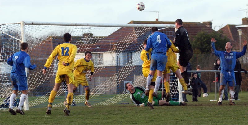 Rustington keeper Andy McCarthy tries to rescue the game with a HEADER!
