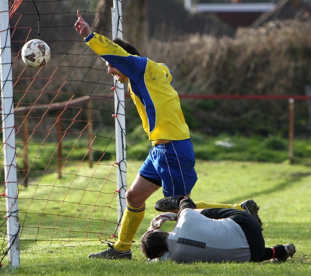 This effort by Dan Griffin is ruled out for a foul on the keeper
