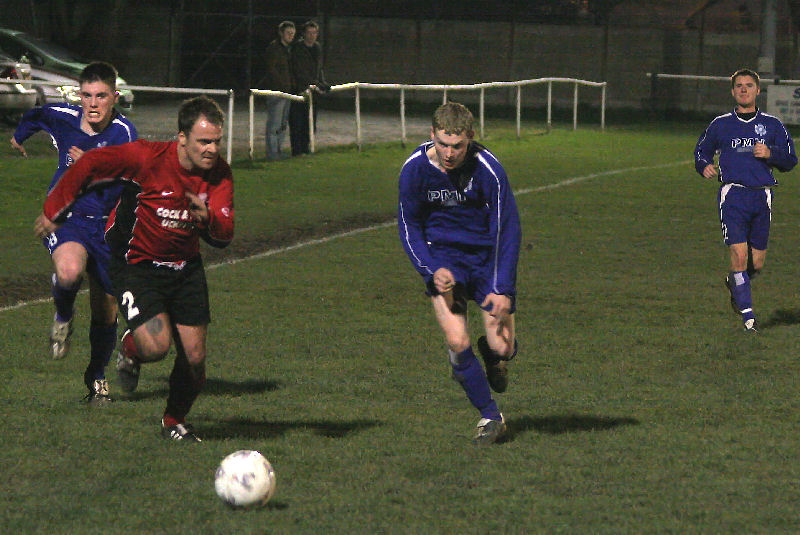Danny Gardiner (2) competes with James Highton with Ollie Rowland (6) bearing down
