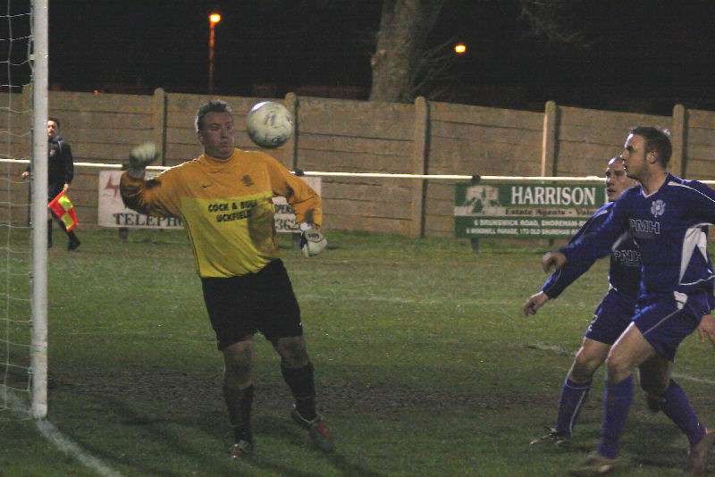 Graham Leach punches the ball to safety
