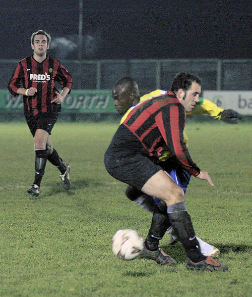 Pete Christodoulou tackles Manny Omoyinmi
