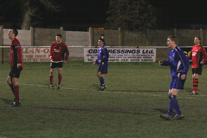 Mike Hatch (centre) sees his shot hit the bar but James Highton (2nd right) is ready to knock the rebound back in....
