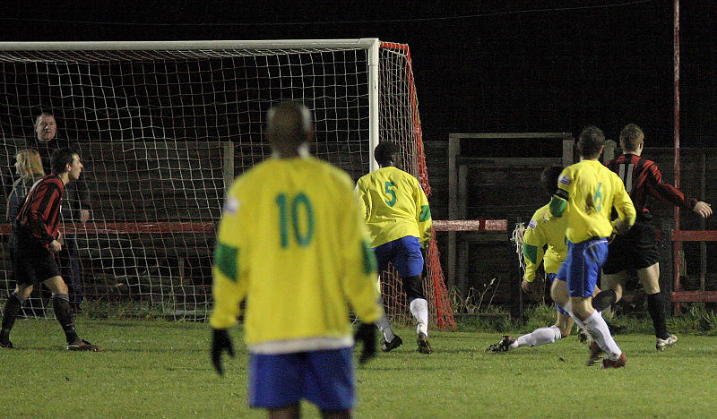Danny Curd (11) just cannot reach the ball as Djoumin Sangare (5) and Paul Kennett (6) cover
