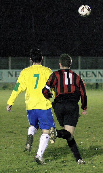 Mo Harkin (7) and Danny Curd (11) race for the ball
