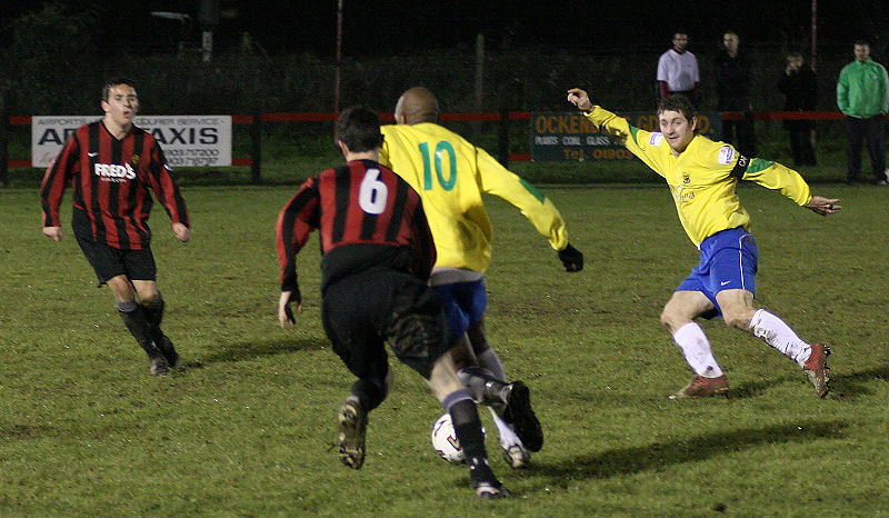 Dave Sharman (6) chases after Jean-Michel Sigere (10) with Lewes captain Paul Kennett close by
