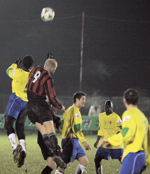 Kane Evans (9) jumps with Djoumin Sangare
