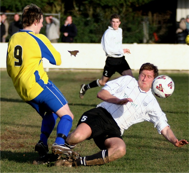 Jay Head gets the ball away from Liam Baitup
