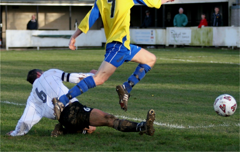 Des Guille gets the ball away from Mark Goodwin
